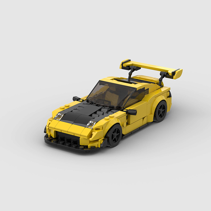 Vibrant yellow Keisuke Mazda RX-7 building blocks set, made from eco-friendly ABS plastic, compatible with Lego, measuring approximately 17 x 8 x 5 cm