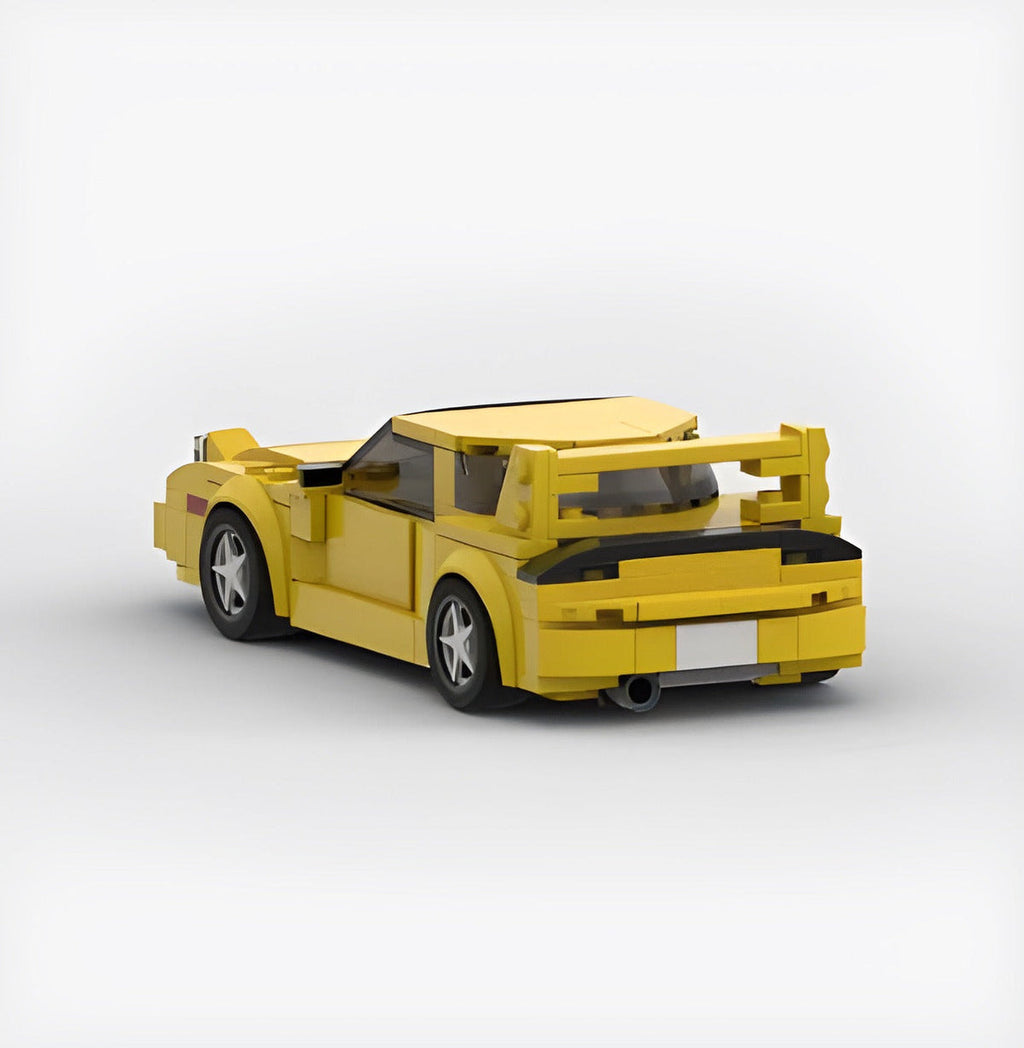 Bright yellow Keisuke Mazda RX-7 building block set made of eco-friendly ABS plastic with ~300+ pieces, measuring approximately 17 x 8 x 5 cm