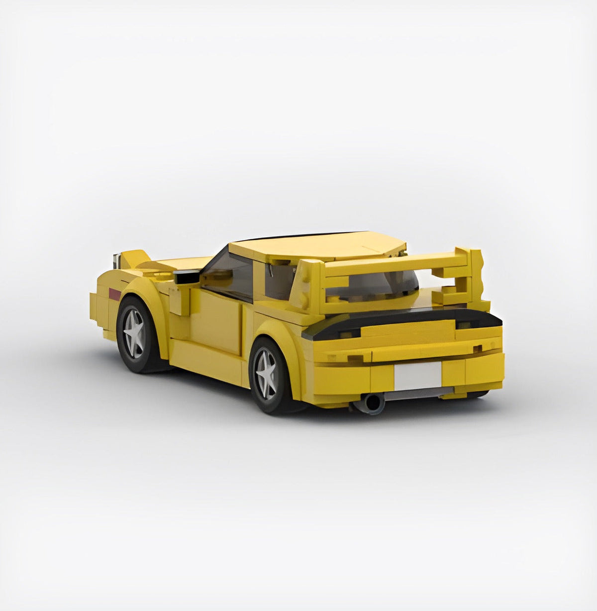 Bright yellow Keisuke Mazda RX-7 building block set made of eco-friendly ABS plastic with ~300+ pieces, measuring approximately 17 x 8 x 5 cm