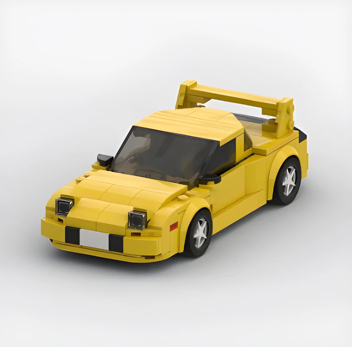Bright yellow Keisuke Mazda RX-7 building block set made of eco-friendly ABS plastic with ~300+ pieces, measuring approximately 17 x 8 x 5 cm.