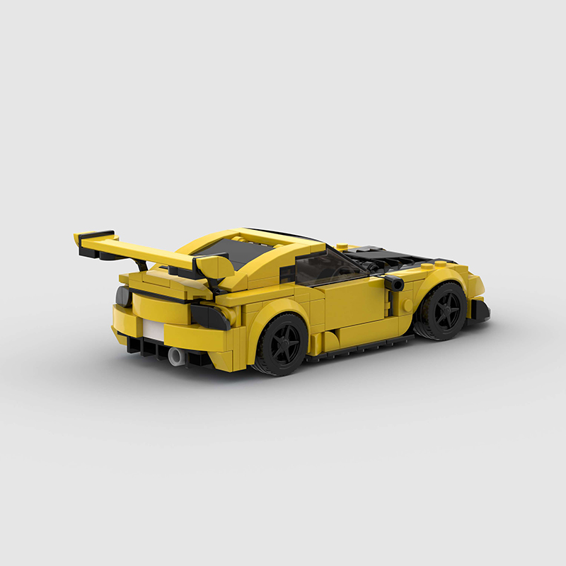Vibrant yellow Keisuke Mazda RX-7 building blocks set, made from eco-friendly ABS plastic, compatible with Lego, measuring approximately 17 x 8 x 5 cm