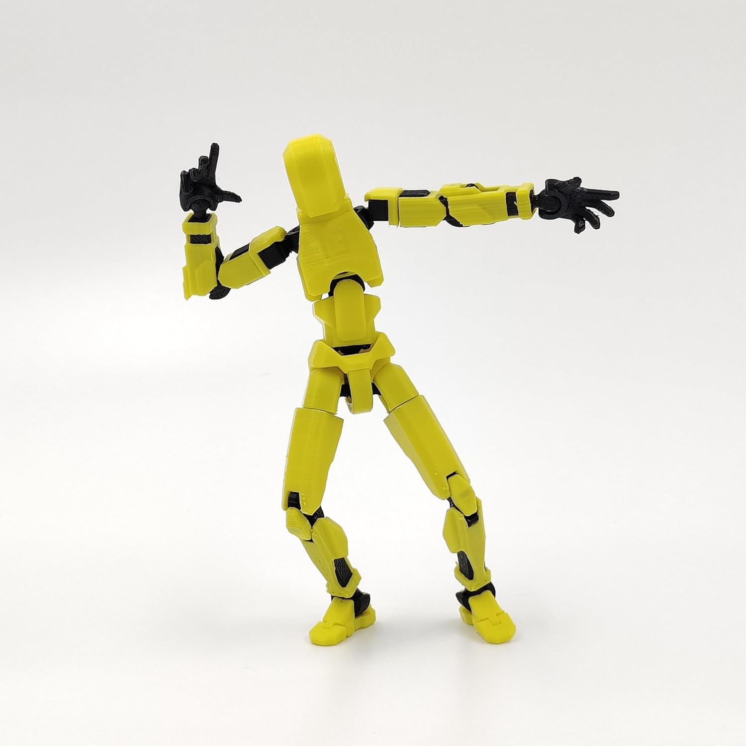 Articulated red robot action figure with multiple joints, made of durable plastic, measuring approximately 4 x 17 x 2 cm.