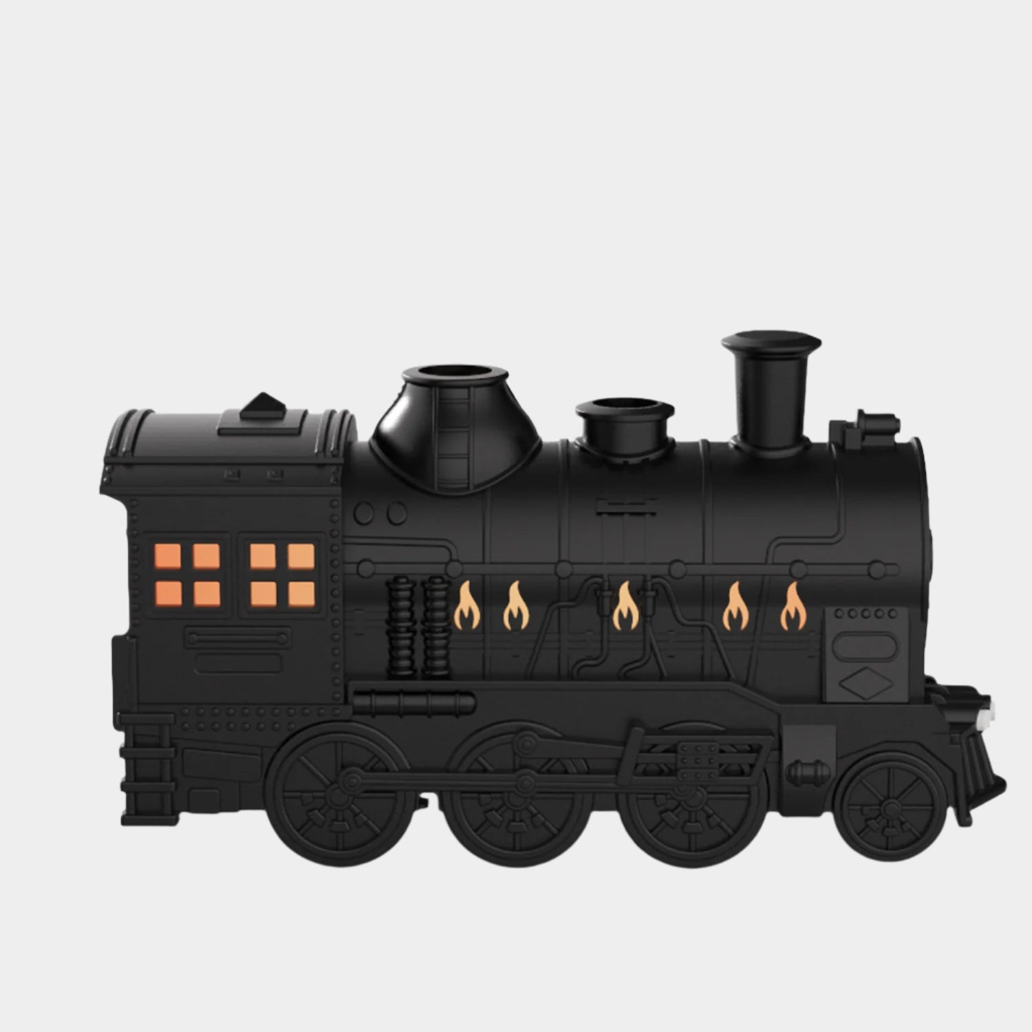 Retro-style small train aromatherapy humidifier in train black with remote control, featuring a large fog spray, dual mist outlets, and a square desktop design