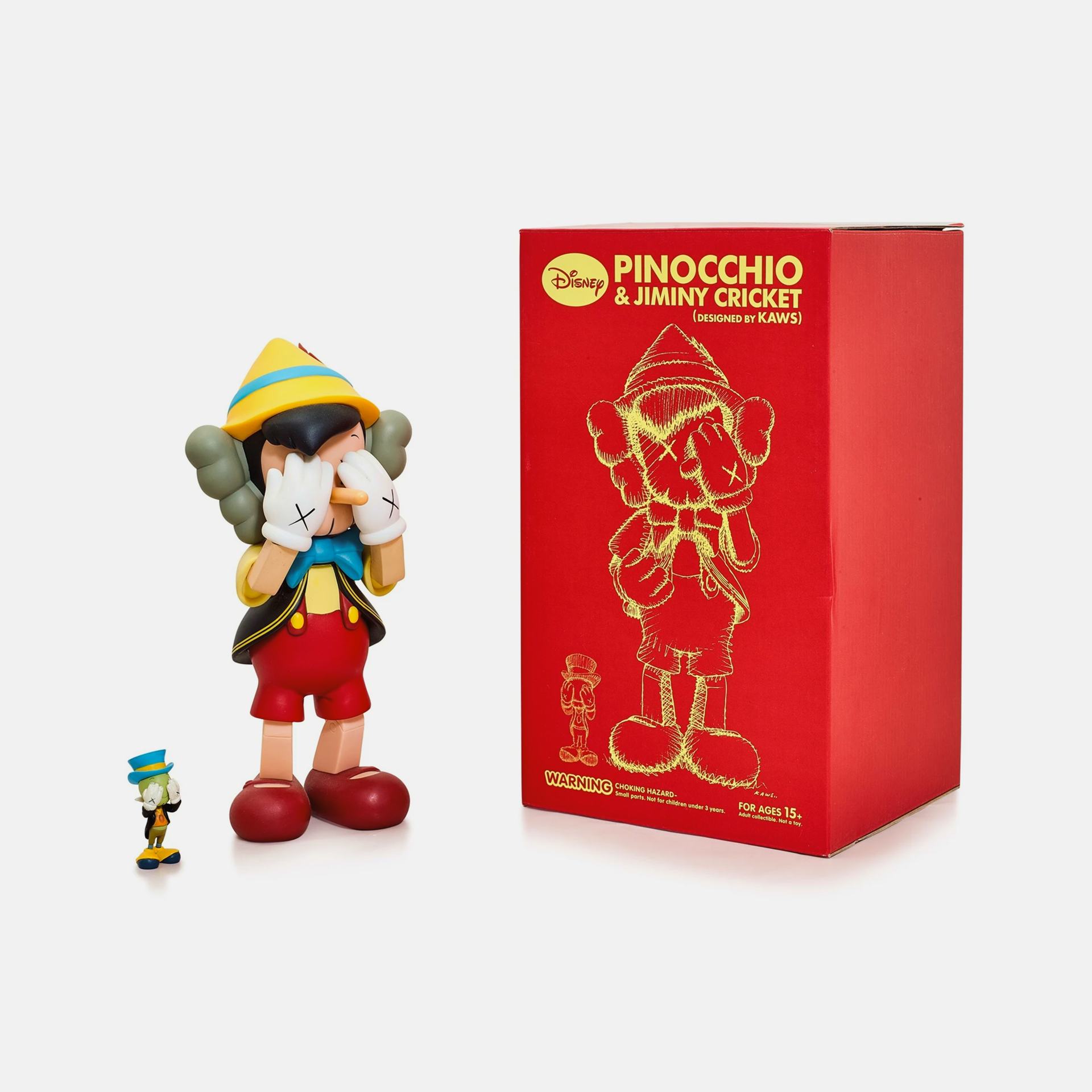KAWS collectible cast vinyl figure featuring Pinocchio and Jiminy Cricket, limited edition from 2010, measuring 26×12.7×11.4 cm.