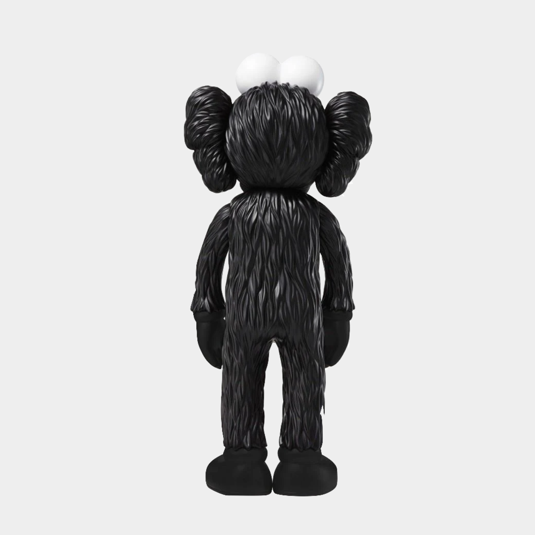 KAWS Companion figure in pink and black from the BFF Open Edition series, measuring 35.6 x 16 x 9.9 cm