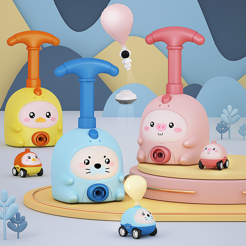 Pig-shaped aerodynamic balloon car educational toy made from durable ABS plastic for kids aged 7-14, demonstrating fun physics in action